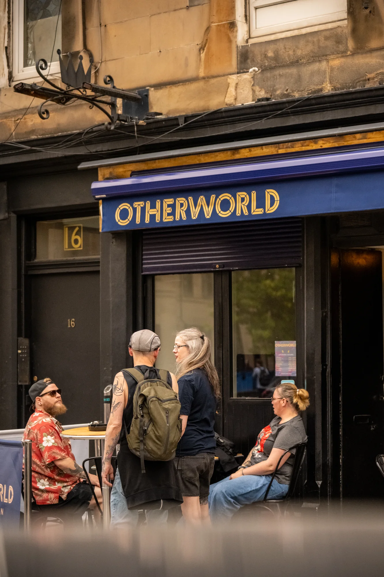 People outside Otherworld Bar & Kitchen on Leith Walk.