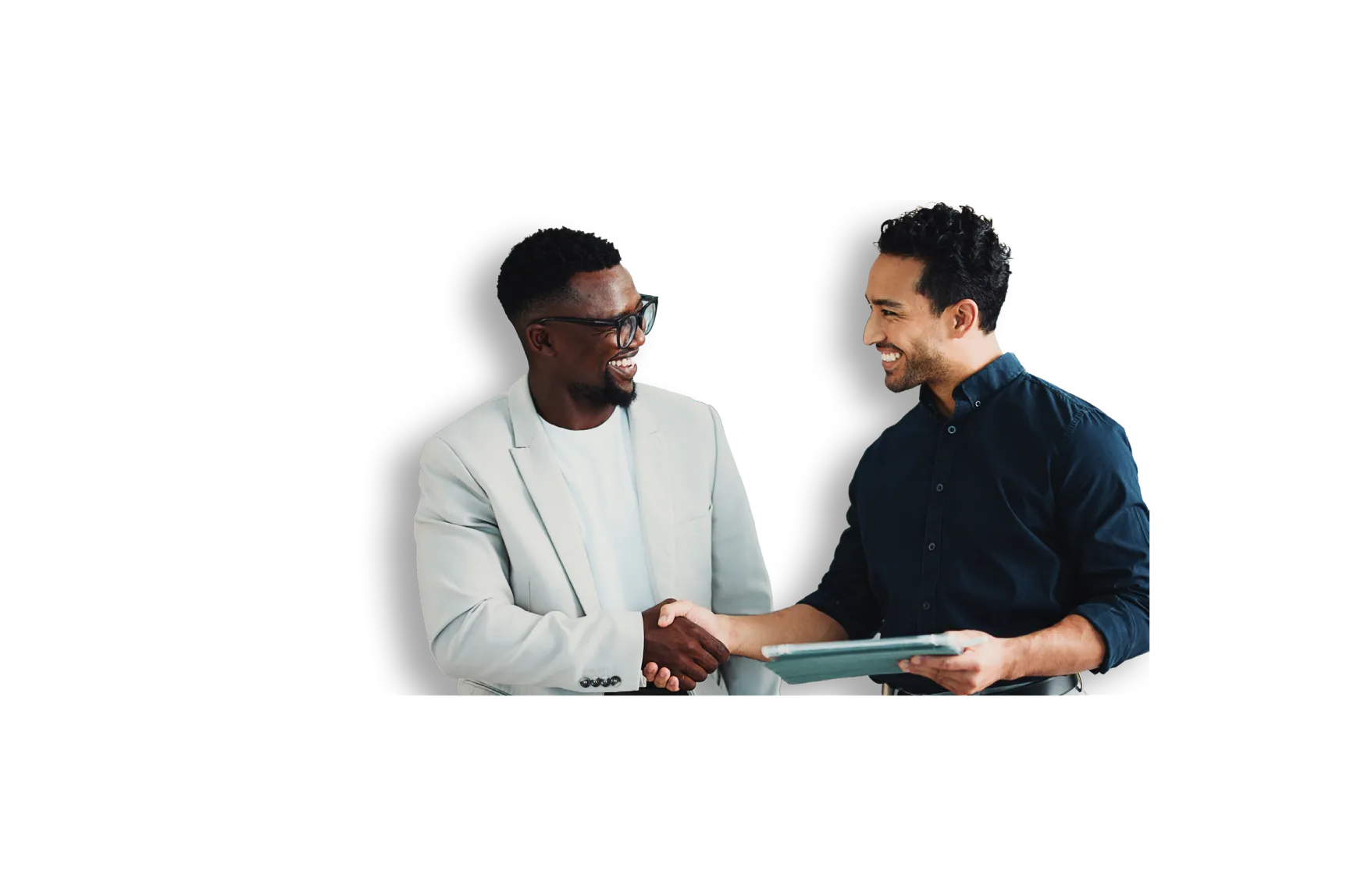 Two men smiling and shaking hands, one holding a digital tablet, isolated on black background.