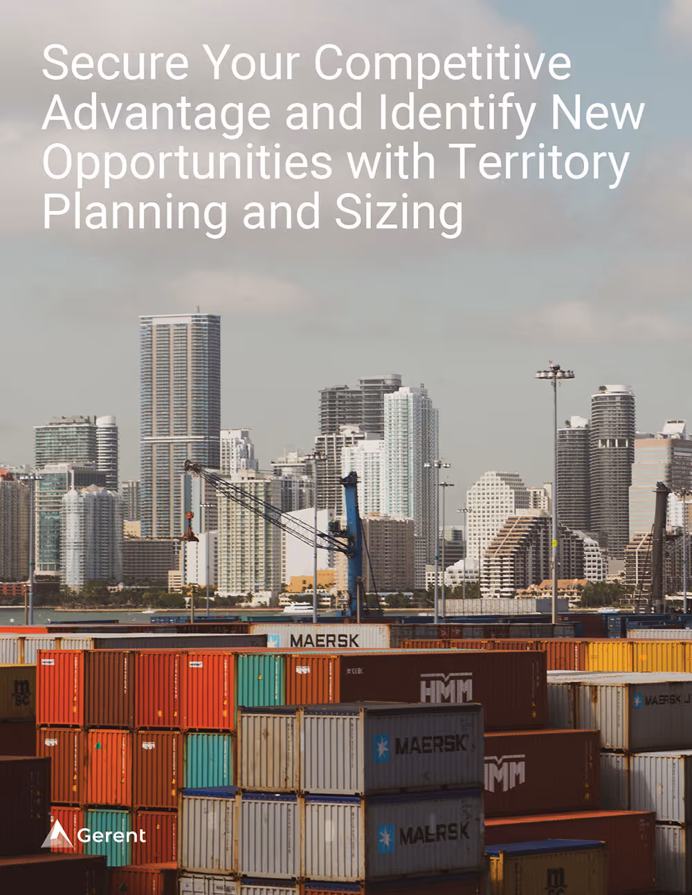 shipping containers stacked at a waterfront port with city buildings in the background