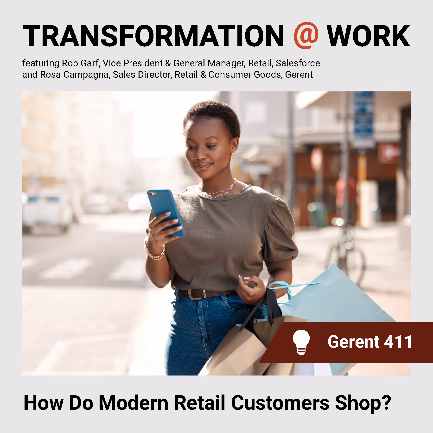 Person walking looking at a cellphone with shopping bags on her arm