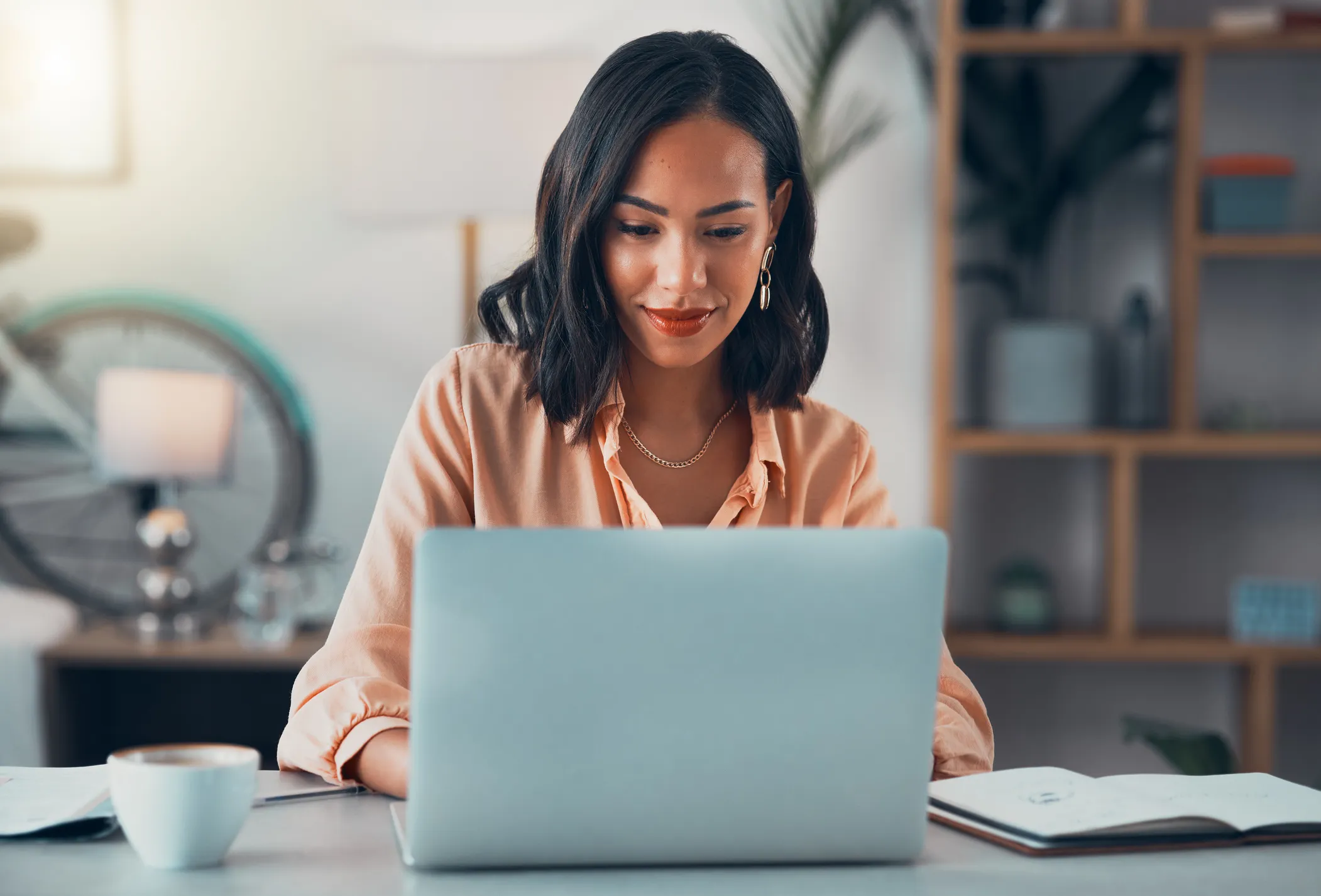 Women sitting in front of a laptop computer