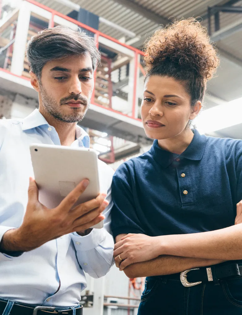 two ppl looking at an ipad