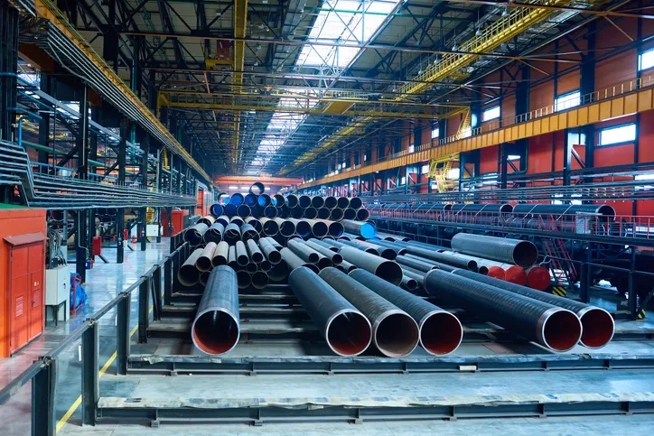 Industrial factory showing equipment and concrete floor.