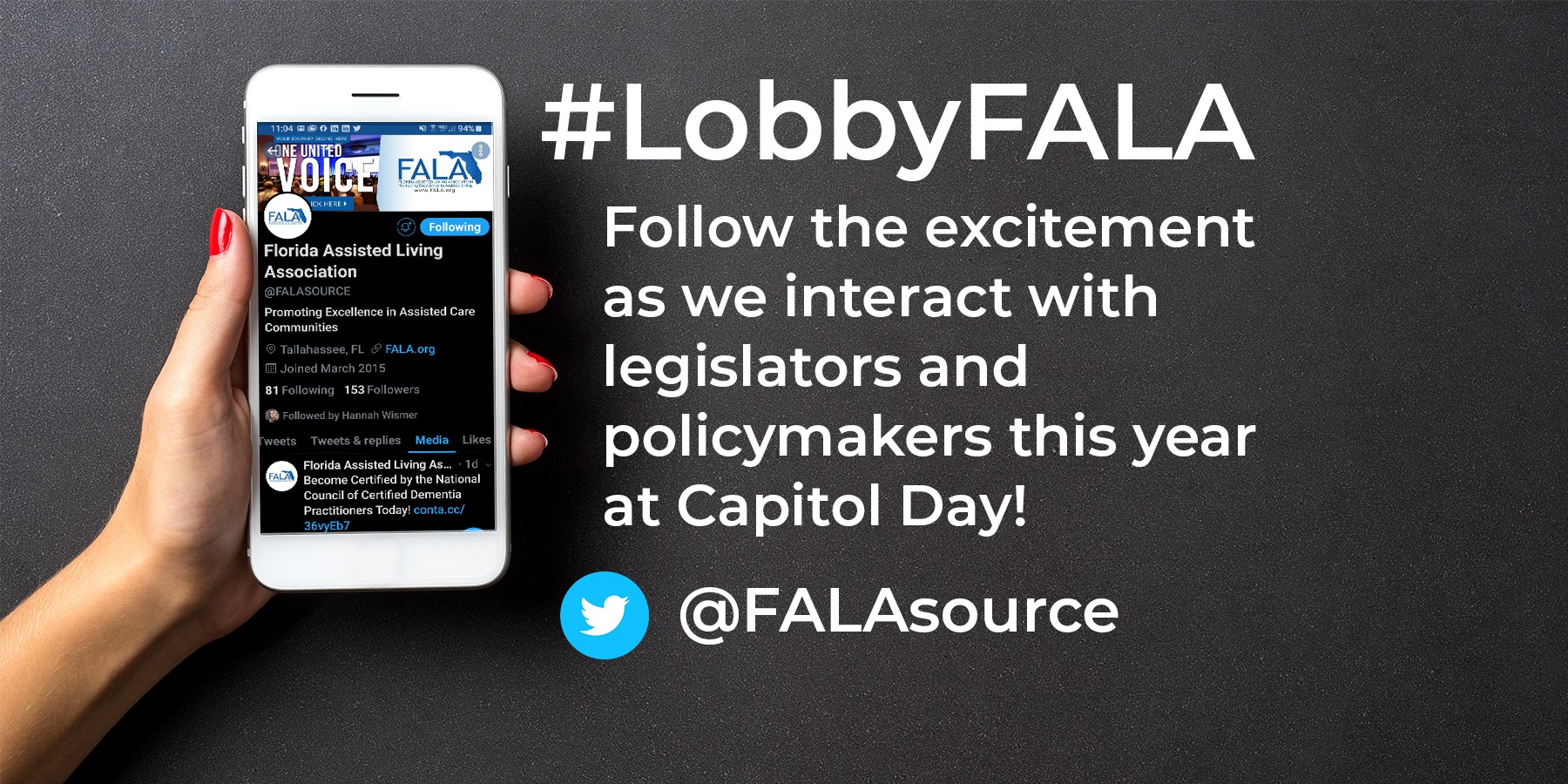 Holding cellphone with FALA website on screen