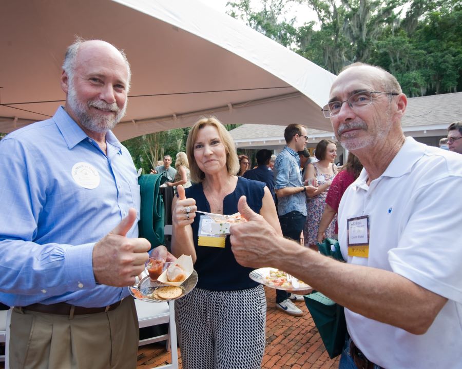 Board members at B3 event with thumbs up