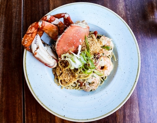 Seafood pasta dish made with crabs and seafood