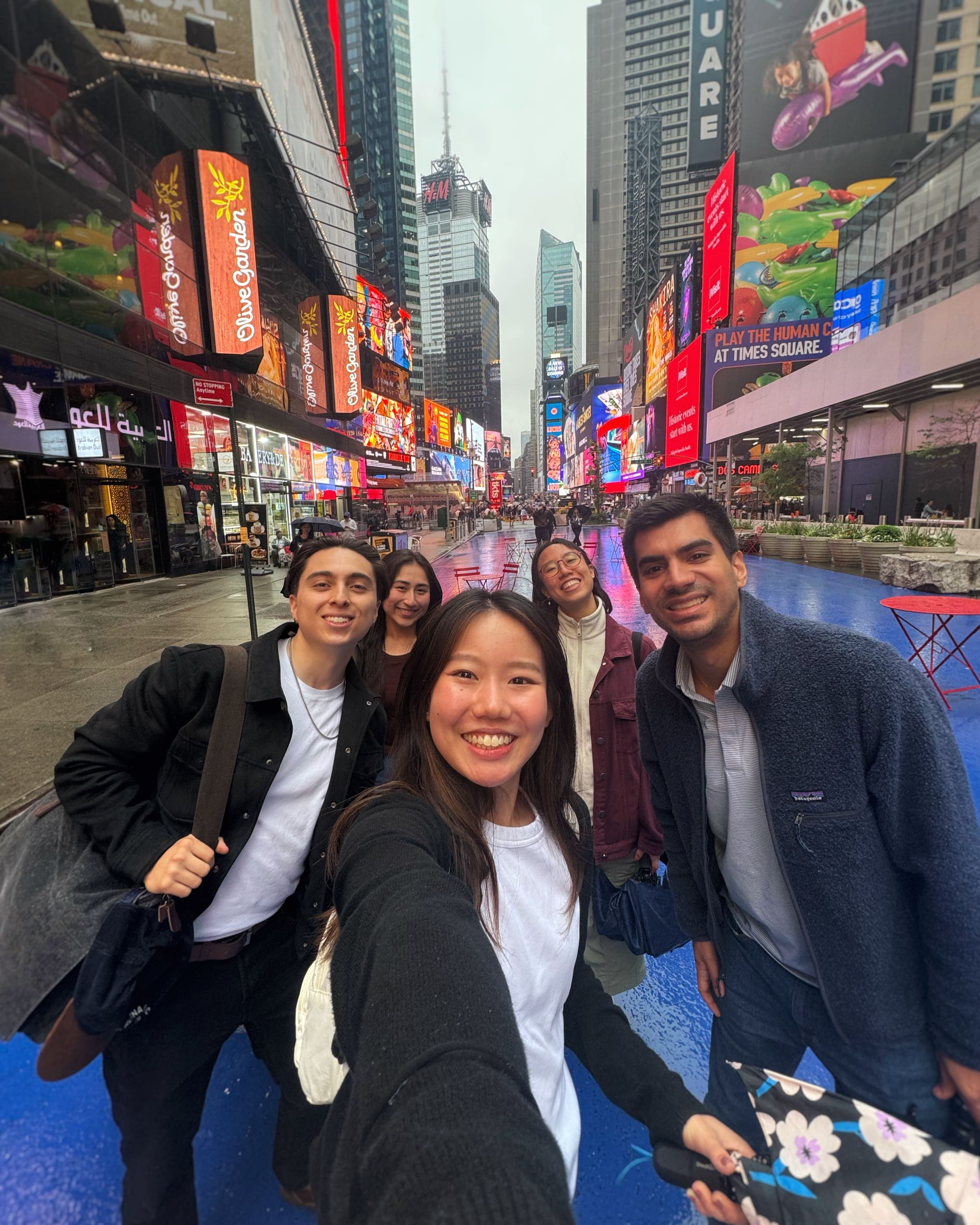 A selfie of myself and four friends with Time Square as the back drop
