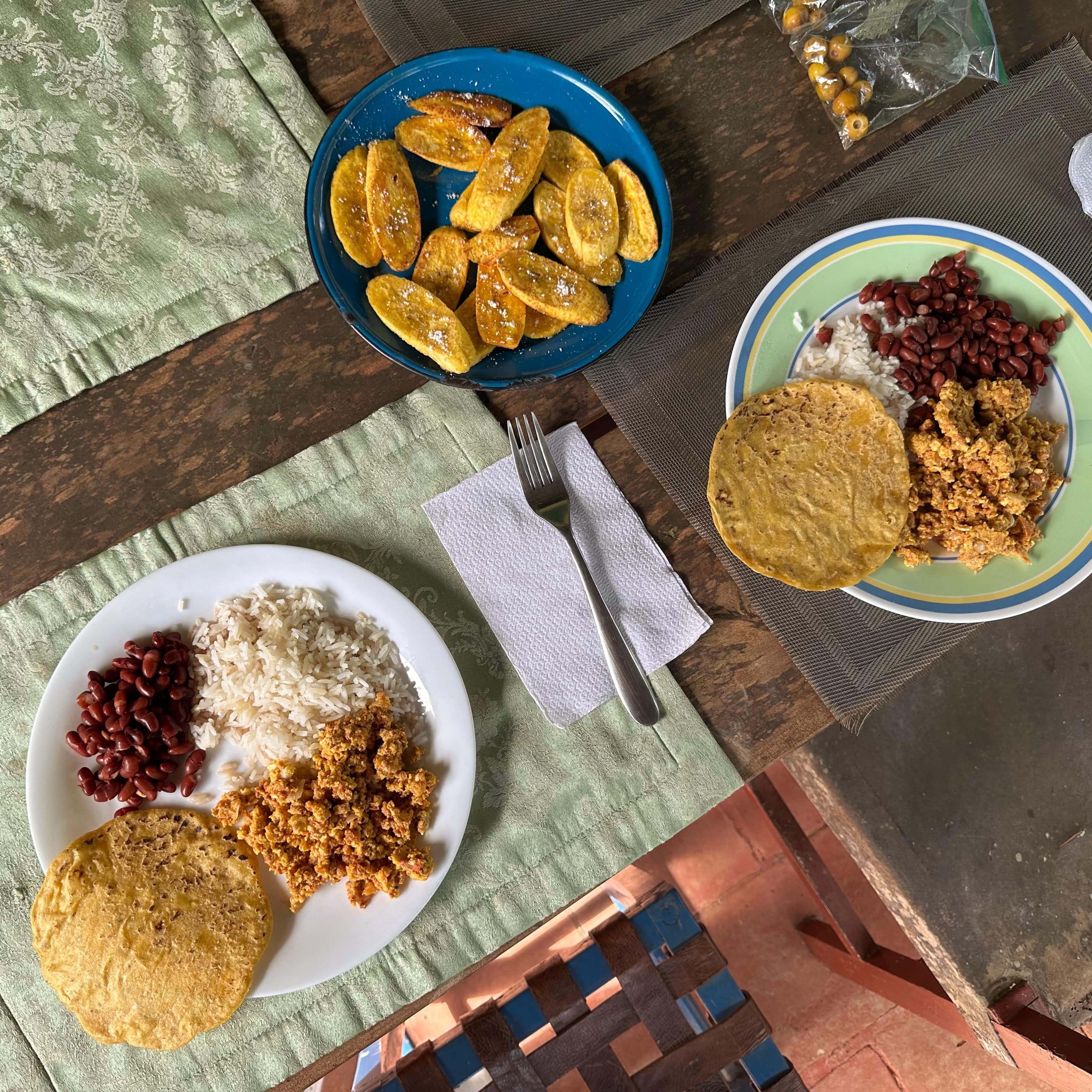 Nicaraguan breakfast with tortillas, rice and beans, eggs and plantains