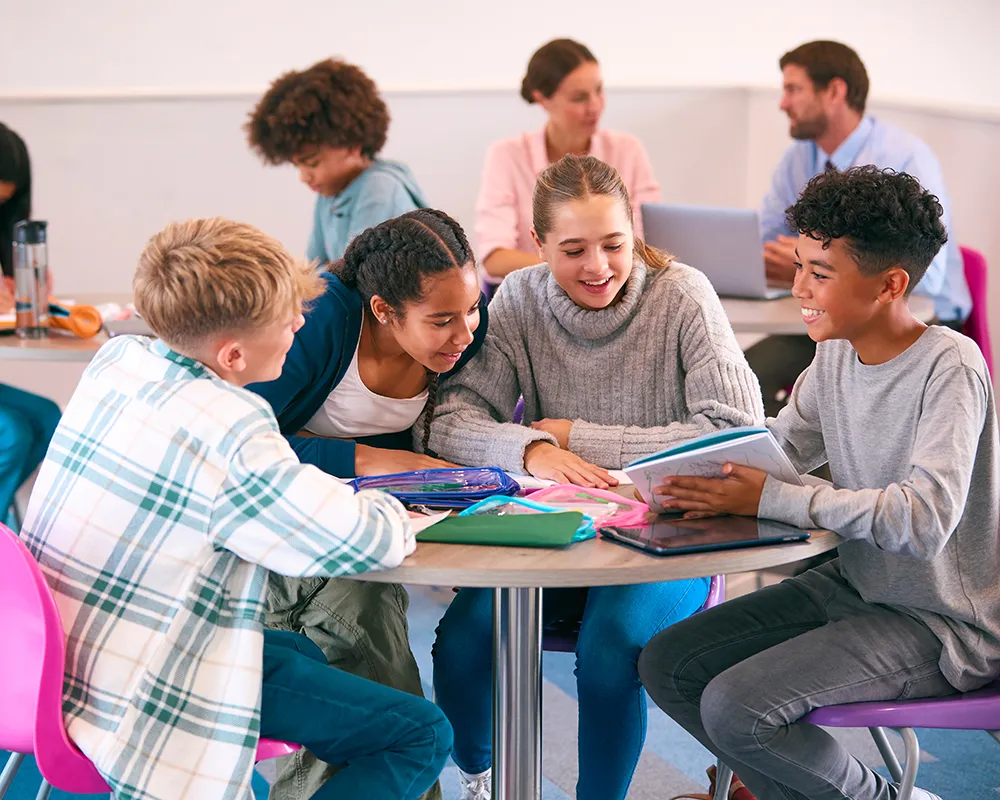 Students working together at a table in school