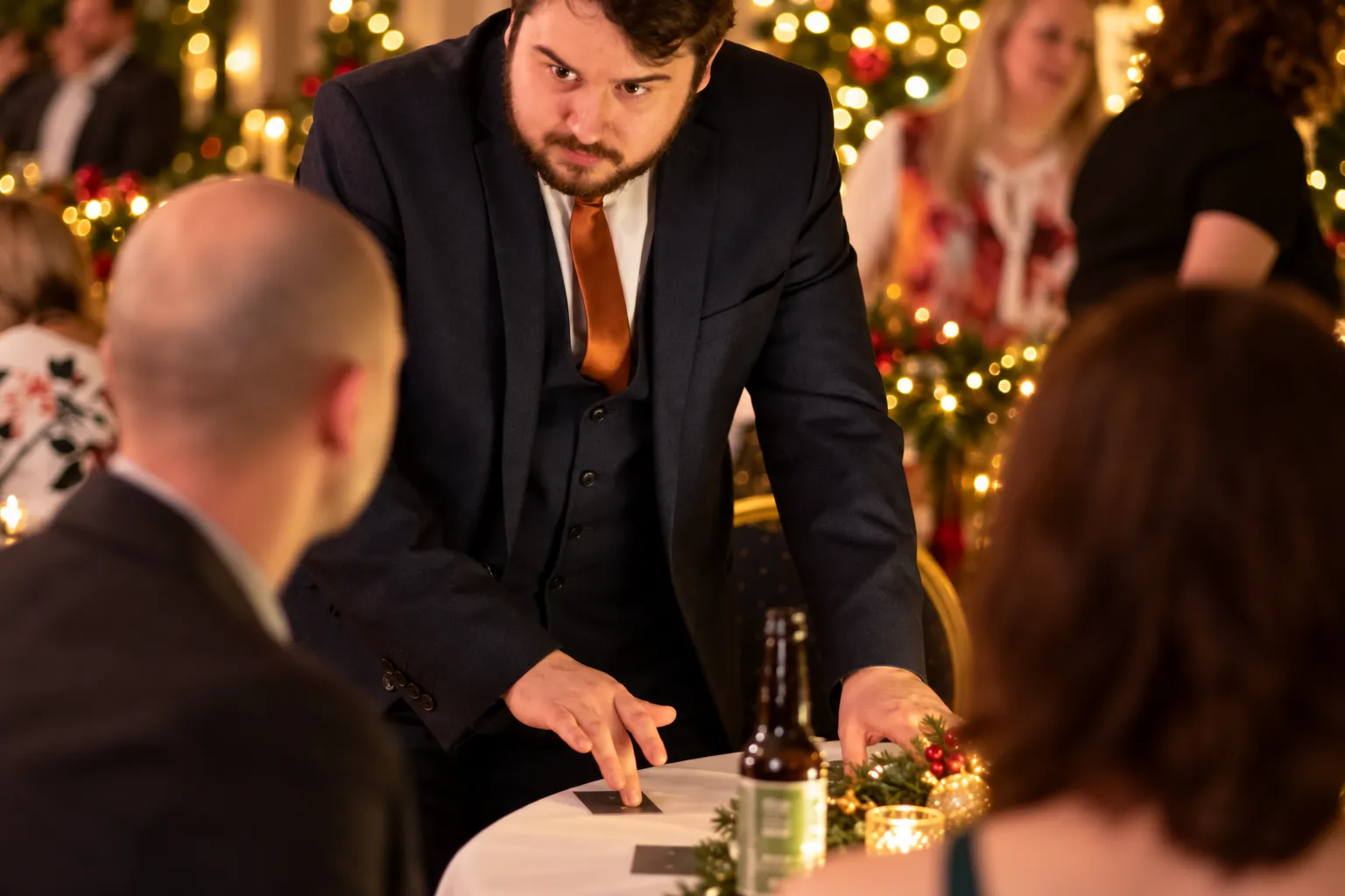 Close up magician entertaining at an office Christmas party