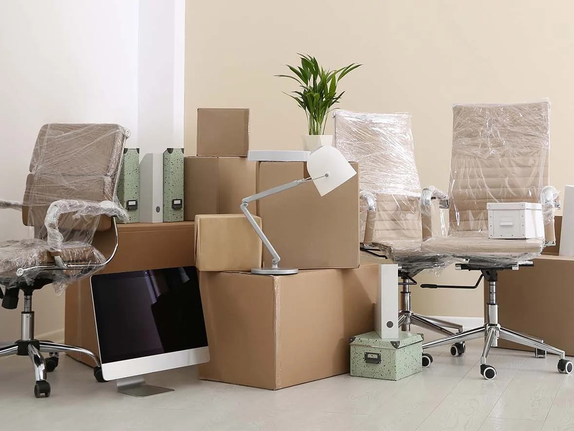 Office chairs and boxes packed for a move