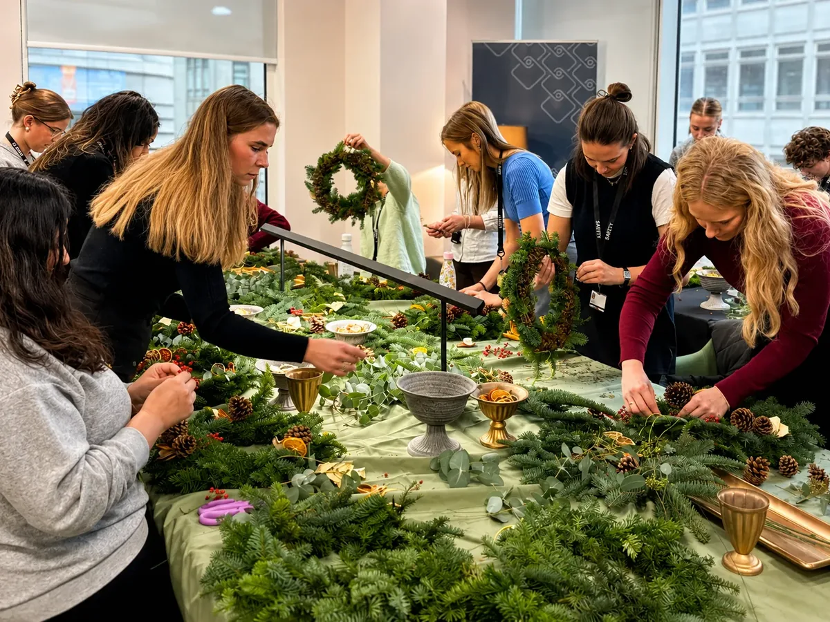Office team making Christmas wreaths
