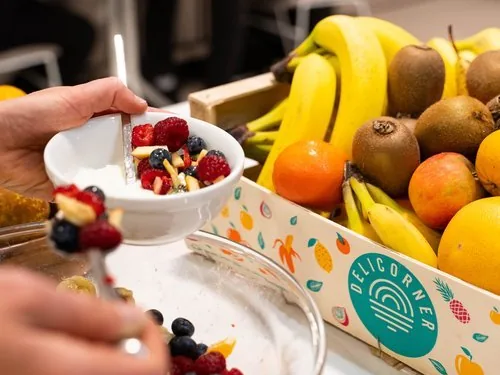 Fresh fruit box and fruit salad in an office kitchen