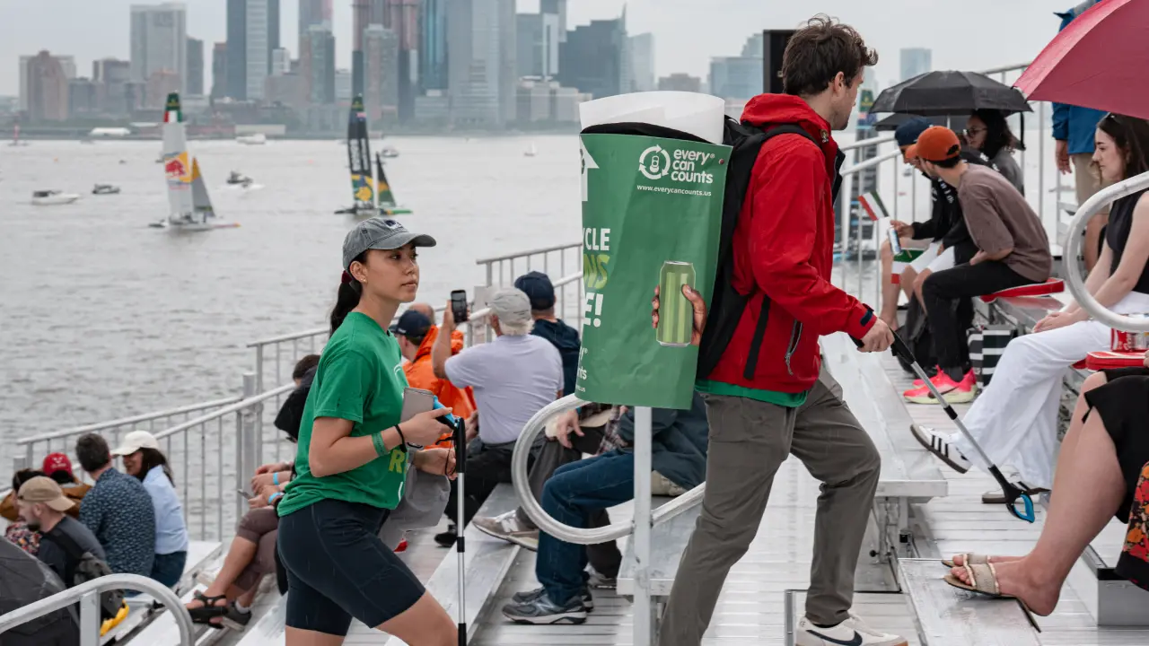 Volunteers look for recyclables in the SailGP grandstand