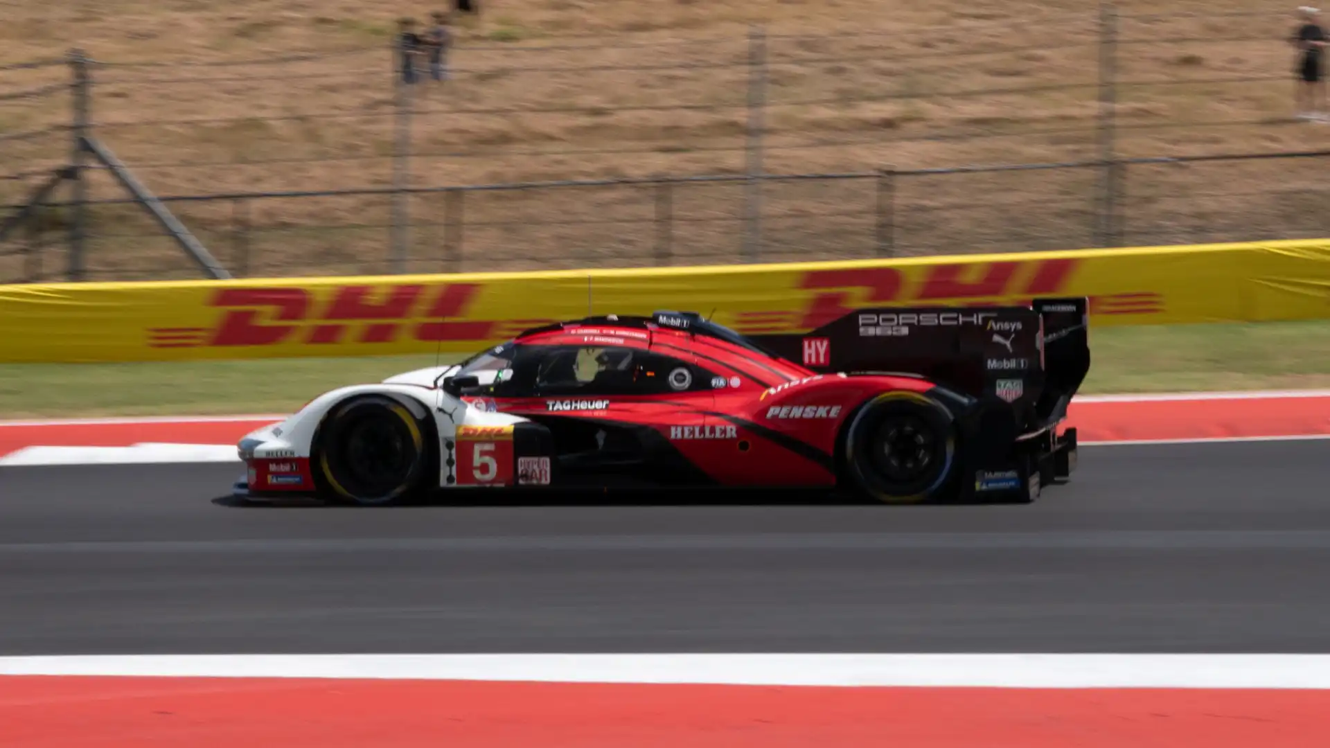 The number 5 Porsche Penske Motorsport car racing at COTA