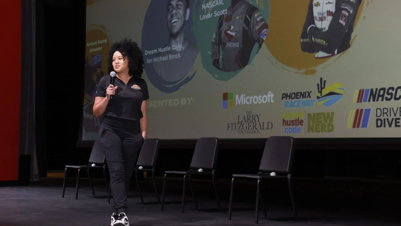 Latasha Causey speaking at a NASCAR event