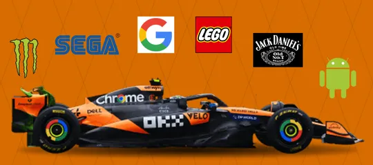 McLaren F1 car with Monster, Sega, Google, Lego, Jack Daniels and Android logos around it.