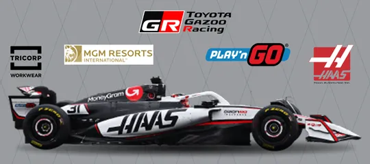 Haas F1 car with Tricopt, MGM Resorts, Toyota Gazoo Racing, Play'n'Go and Haas Automation logos above it