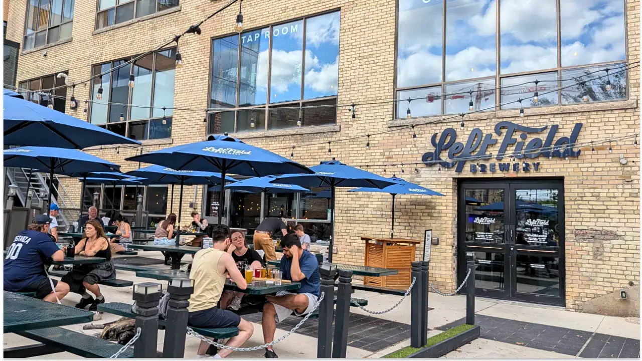 Patio outside of a brewery, full of people enjoying the food