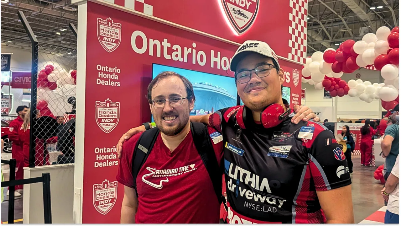 Two friends wearing motorsport gear