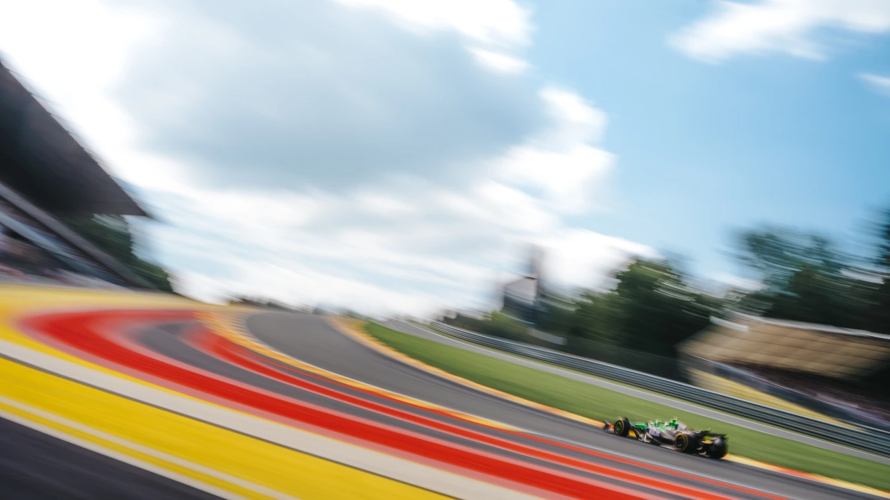 An F1 car racing up Eau Rouge in Spa