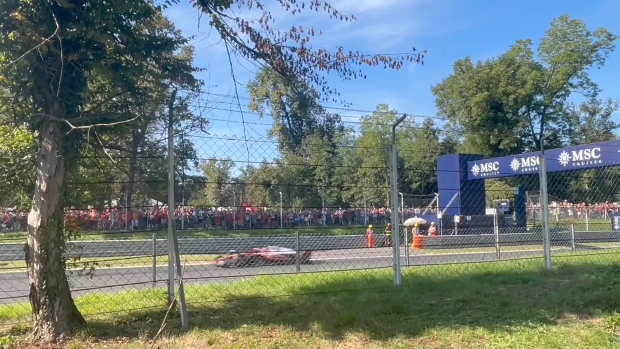 A Ferrari driving past General Admission
