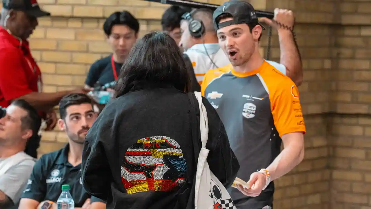 Pato O'Ward with fans at an autograph session