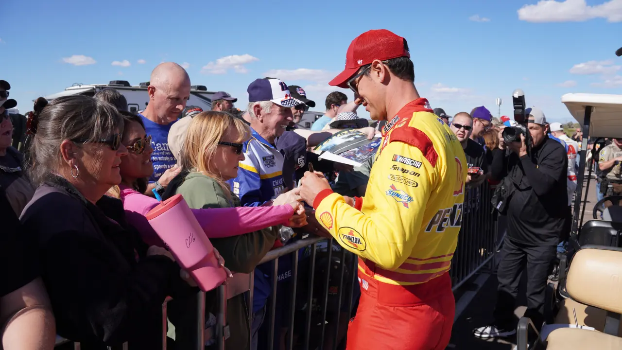 Joey Logano signing autographs at the 2024 Championship race