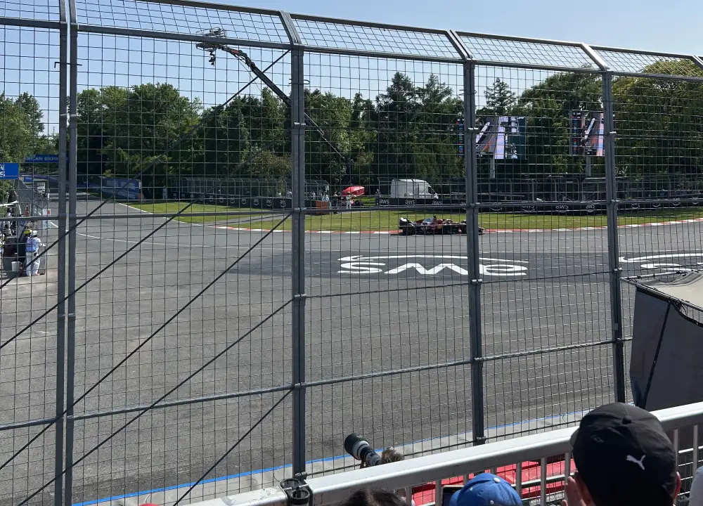 A Ferrari drives by Grandstand 33