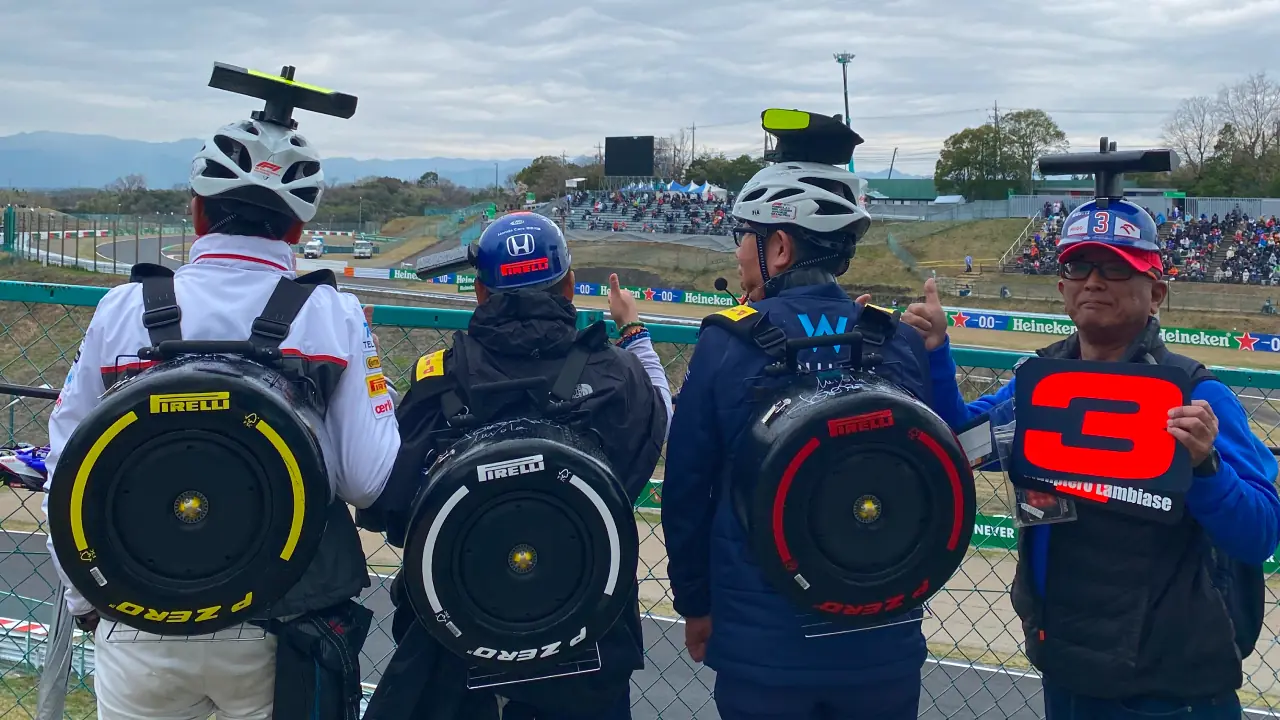 Fans at the Japanese Grand Prix with homemade tire backpacks