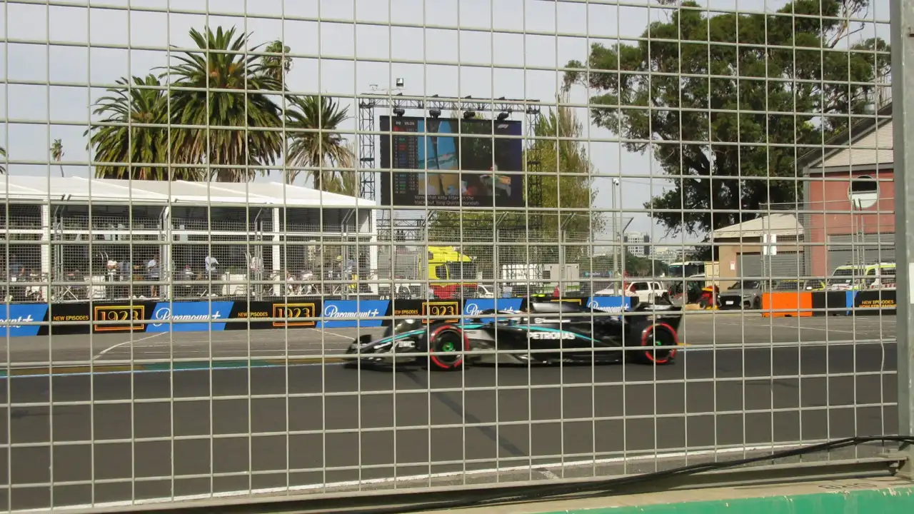 A Mercedes driving by as seen from GA at Turn 13