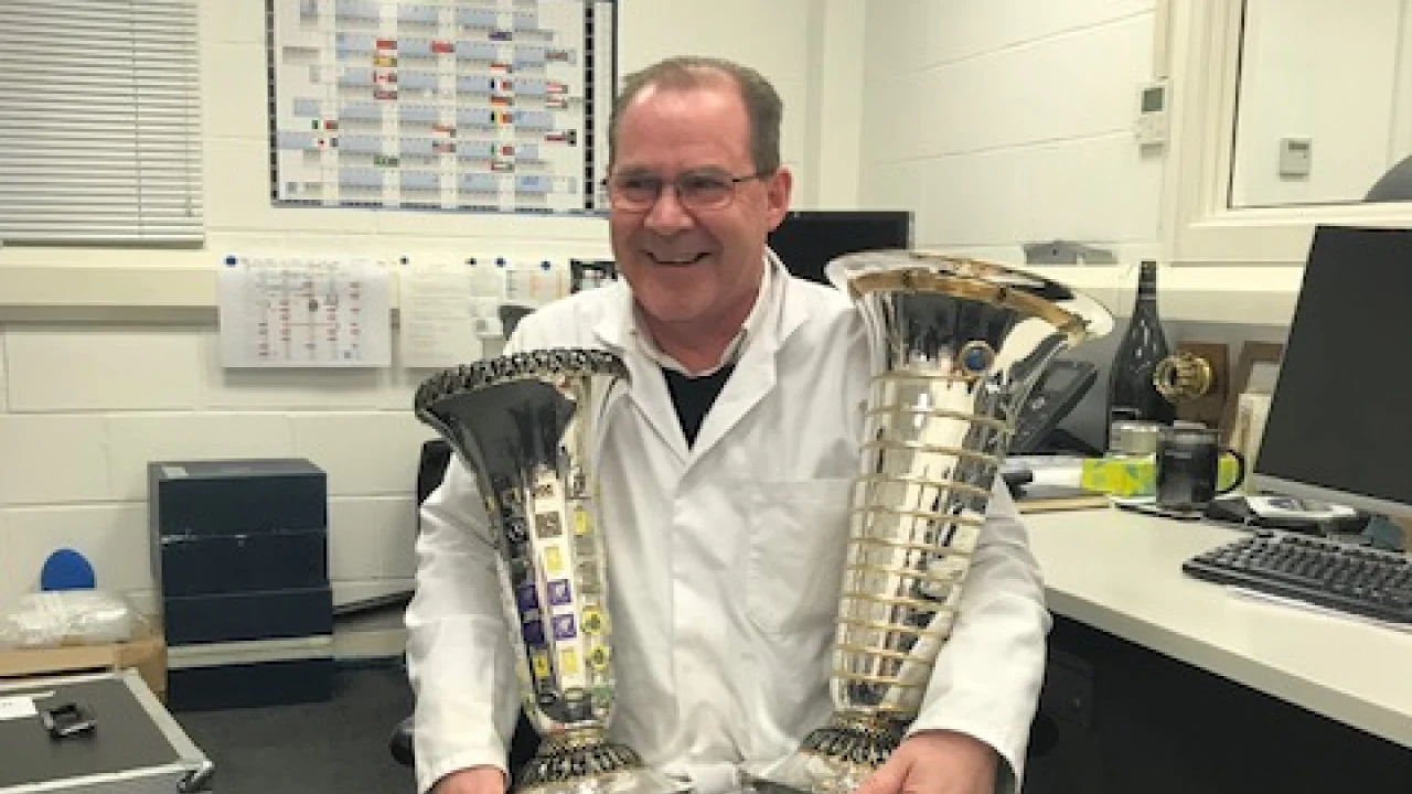Peter Hodgkinson with the F1 Constructors’ and Drivers’ Championship trophies