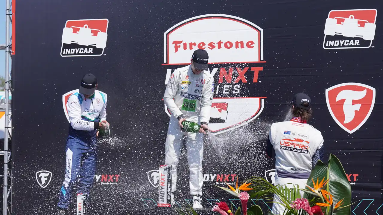 Caio Collet on the podium in Nashville with Dennis Hauger and Lochie Hughes