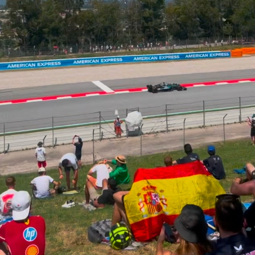 View from GA of a Mercedes F1 car racing by