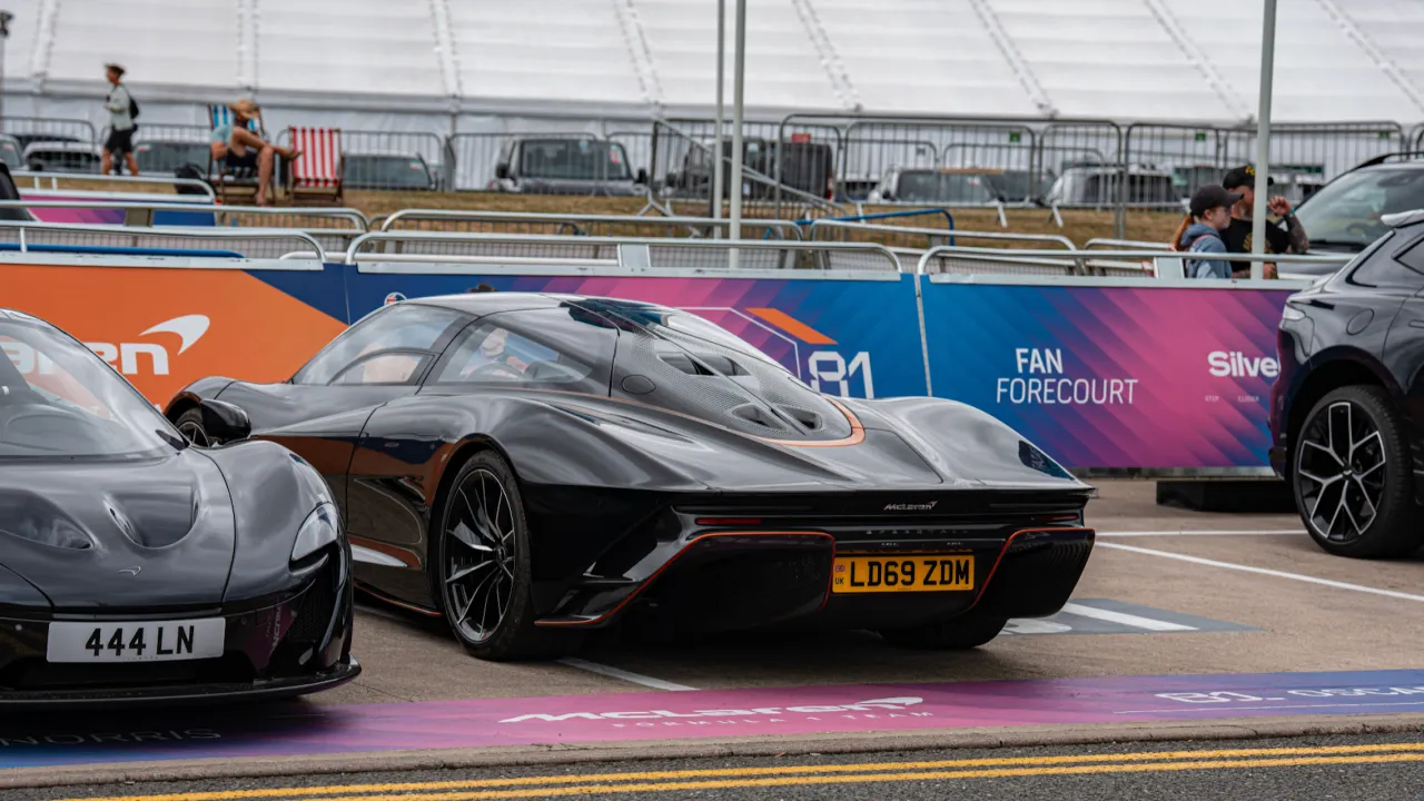 Oscar Piastri and Lando Norris’ McLarens parked at the Fan Forecourt in 2025