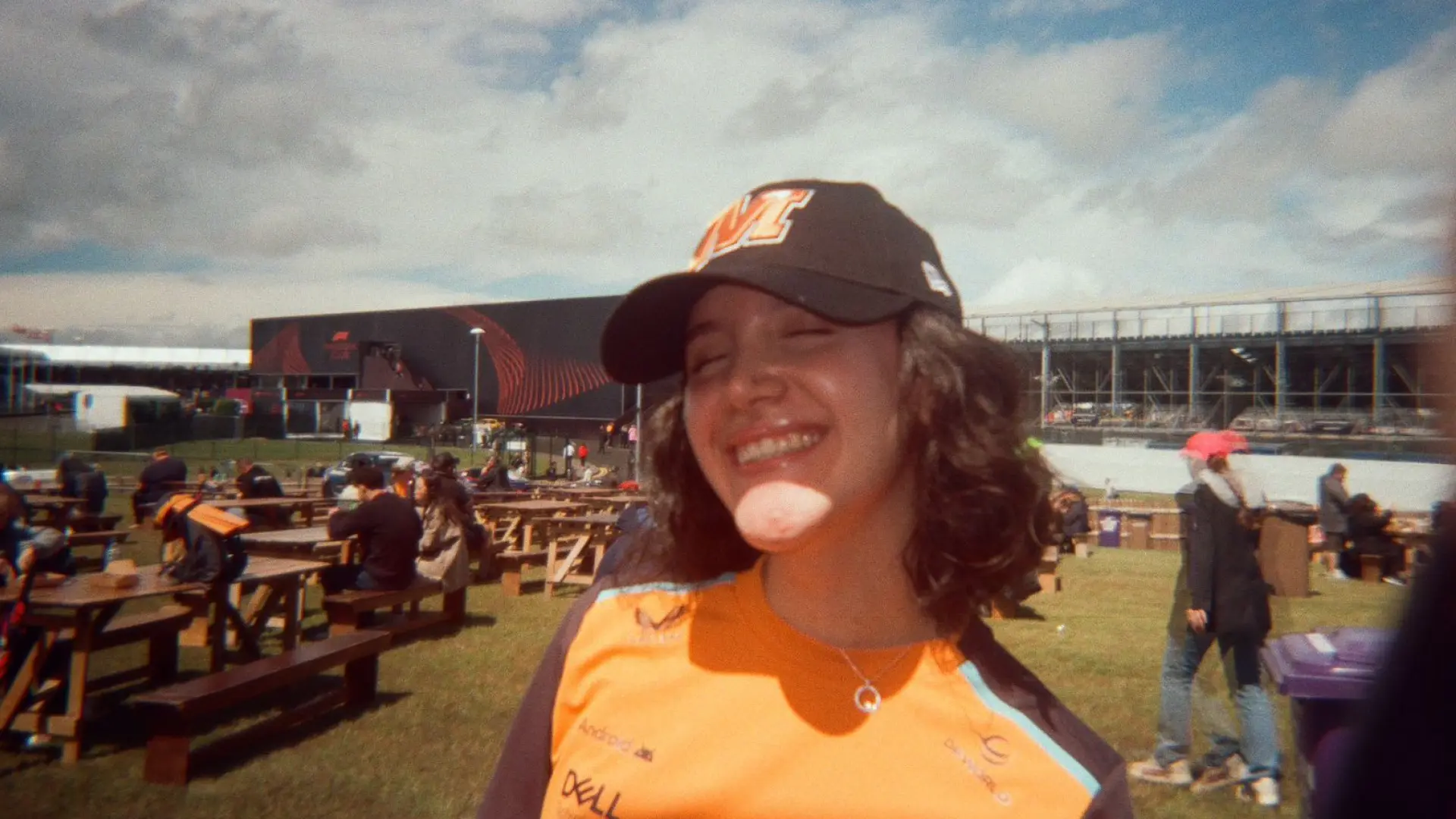 Majo at the benches outside of the grandstand