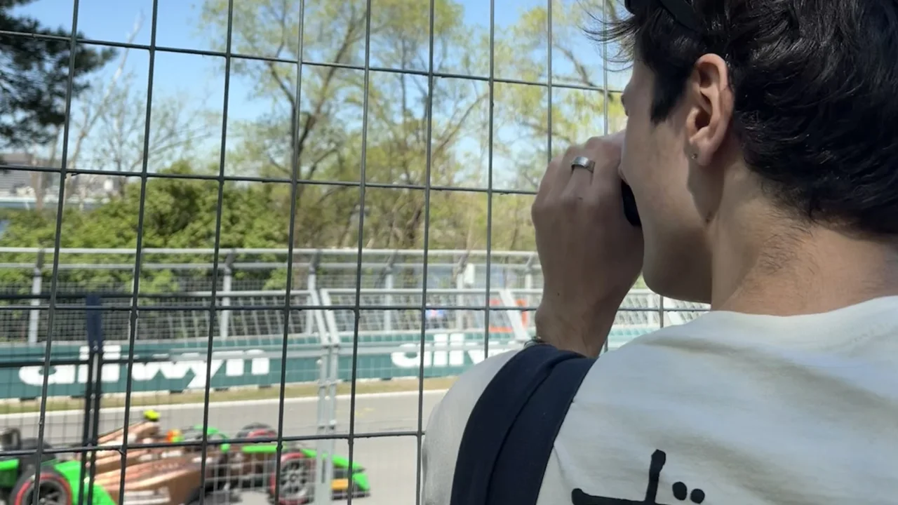 Paul taking photos of a Formula 2 car