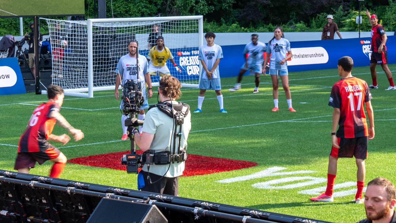 A sideline camera captures the Creator Cup