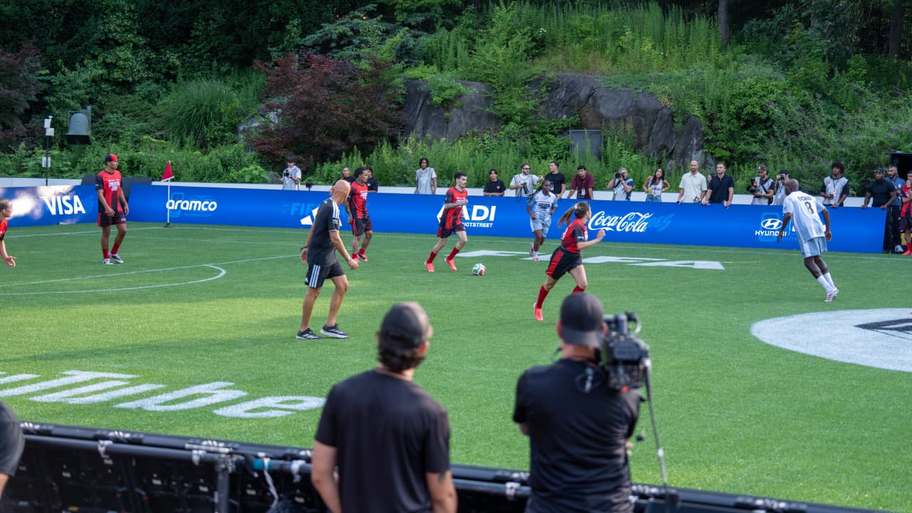 FIFA Partner logos surround the players