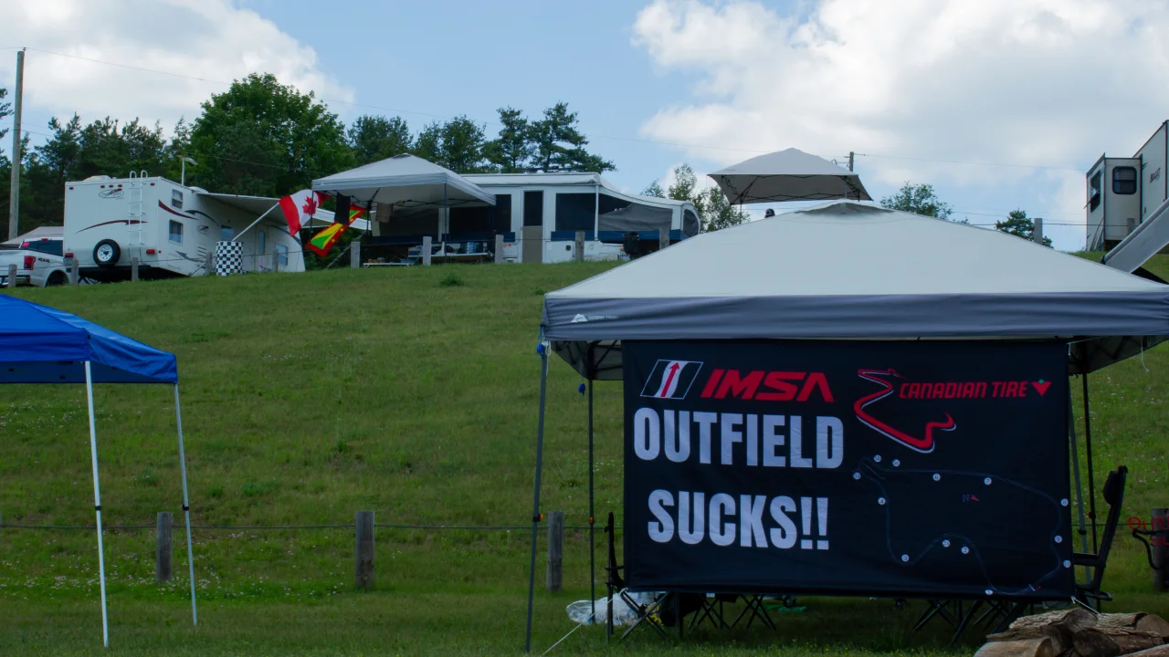An outfield sucks sign on the infield at Turn 3