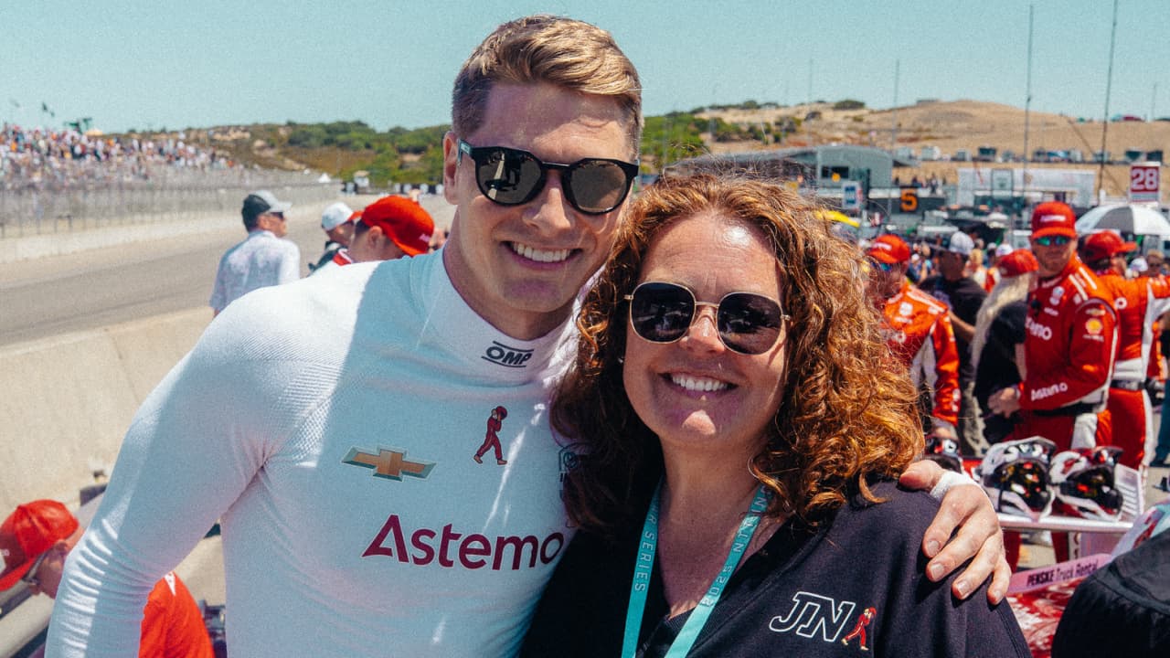 Amy Cavitch and Josef Newgarden in the IndyCar pit lane