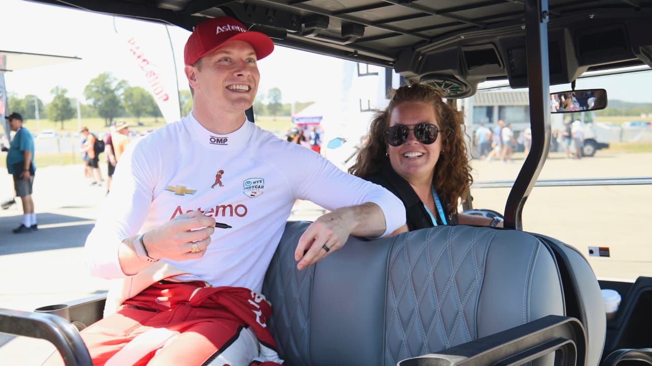 Amy Cavitch and Josef Newgarden at an IndyCar race