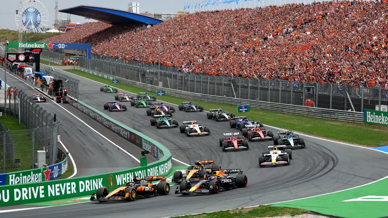 Oscar Piastri and Max Verstappen battle for position at Zandvoort’s Turn 1 (Photo by Clive Rose/Getty Images)