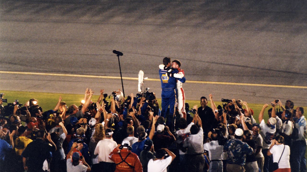 Dale Earnhardt Jr. and Michael Waltrip embrace after a 1-2 finish (Source: Getty Images)