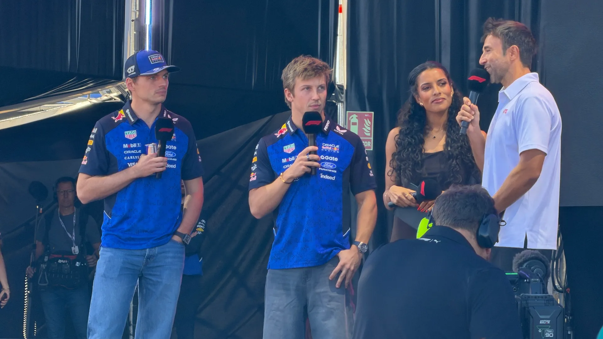 Max Verstappen and Liam Lawson on an F1 Fan Zone stage (Photo: Ric Pacheco/FanAmp)