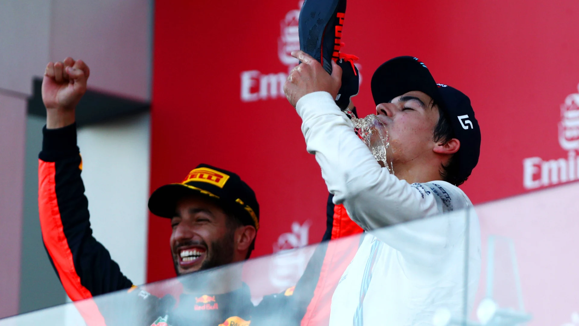 Lance Stroll doing a shoey at the 2017 Azerbaijan Grand Prix with race winner Daniel Ricciardo. (Photo: Dan Istitene, Getty Images/Red Bull Content Pool) 