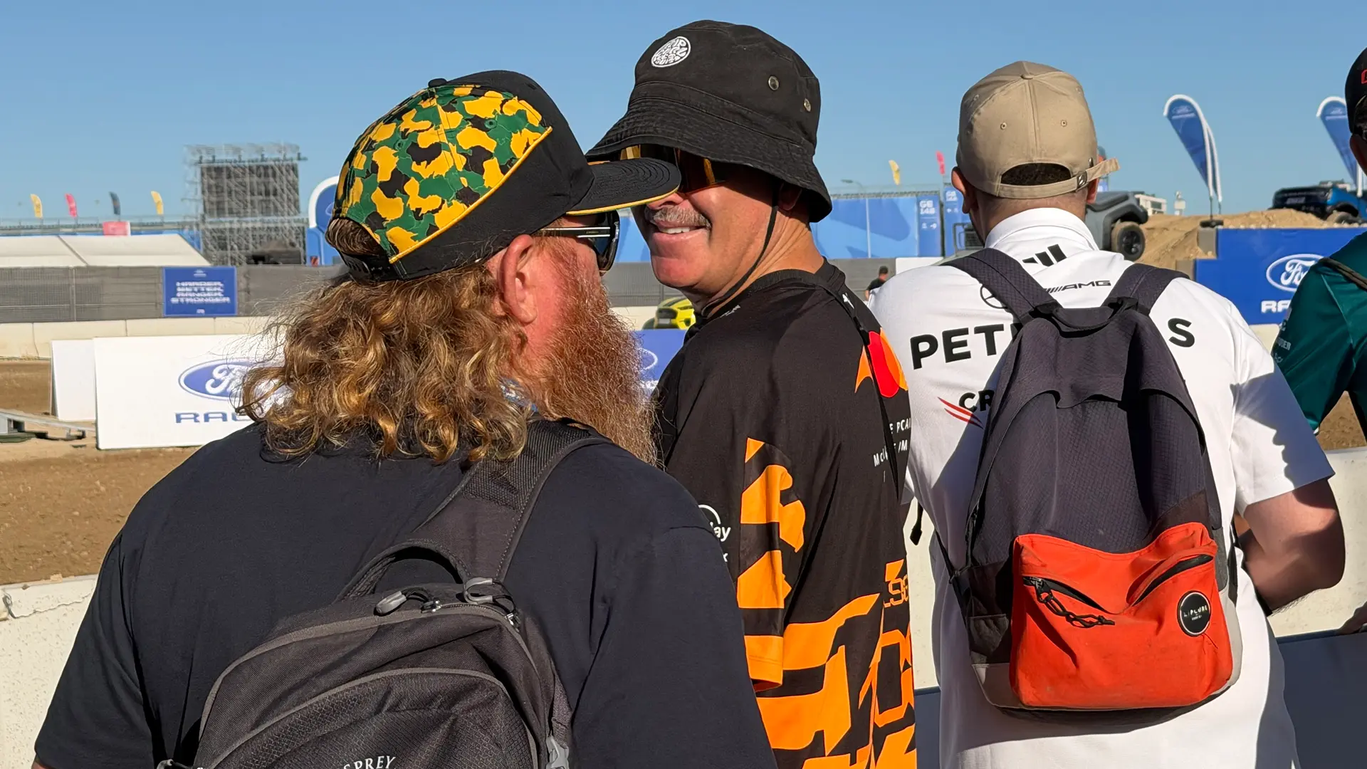 F1 Fans walking with backpacks (Photo: Ric Pacheco/FanAmp)
