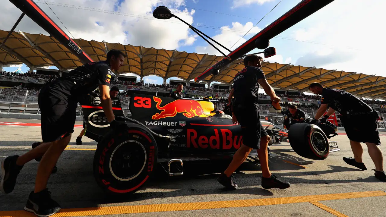 The North section of the Sepang Main Grandstand visible behind a Red Bull F1 car in the pit lane. (Photo: Mark Thompson, Getty Images/Red Bull Content Pool)