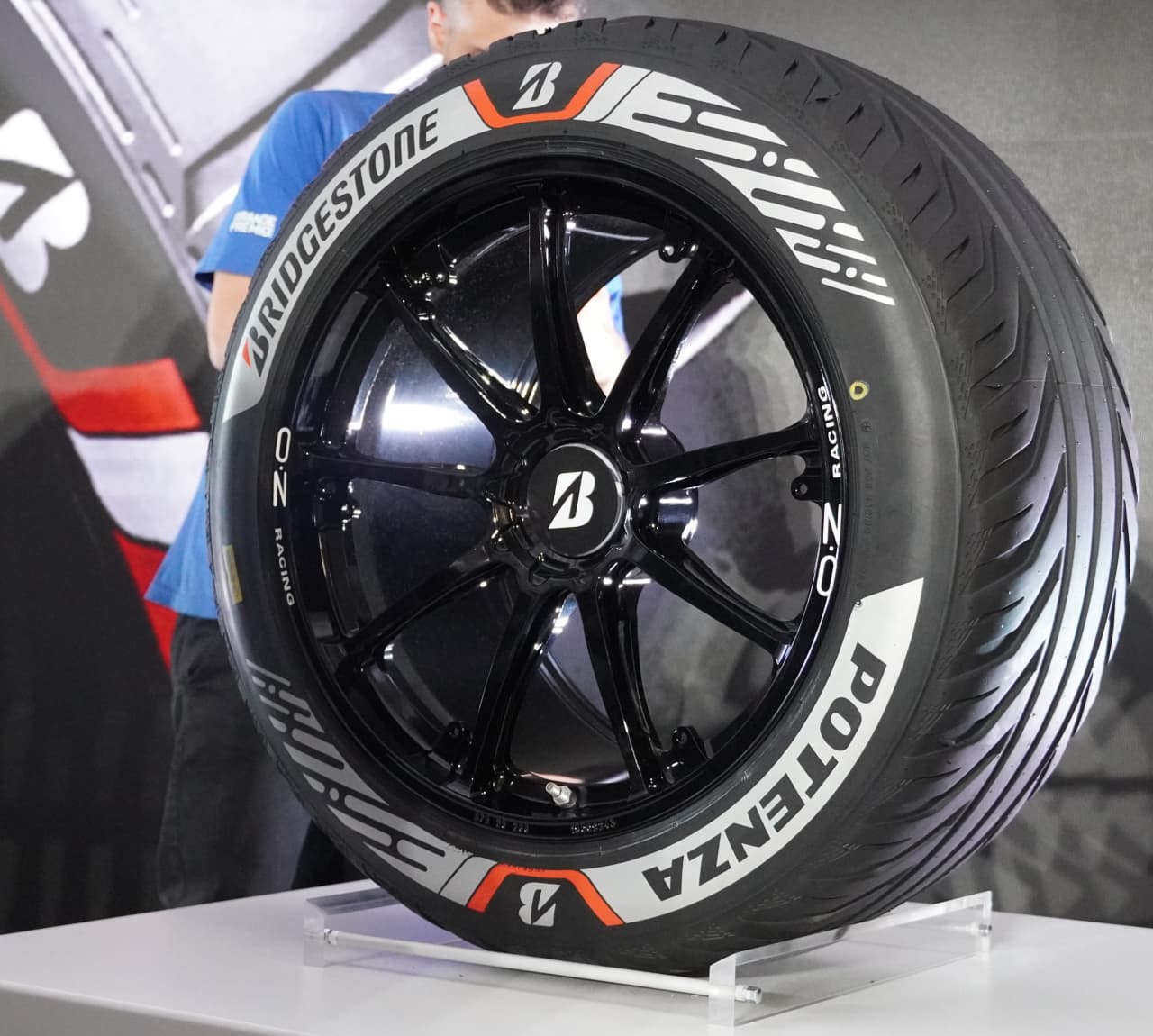 Bridgestone's Potenza Gen4 Typhoon Tire features a predominately gray sidewall; its all-weather tire features more red coloring. (Photo credit: Elizabeth Blackstock/FanAmp)
