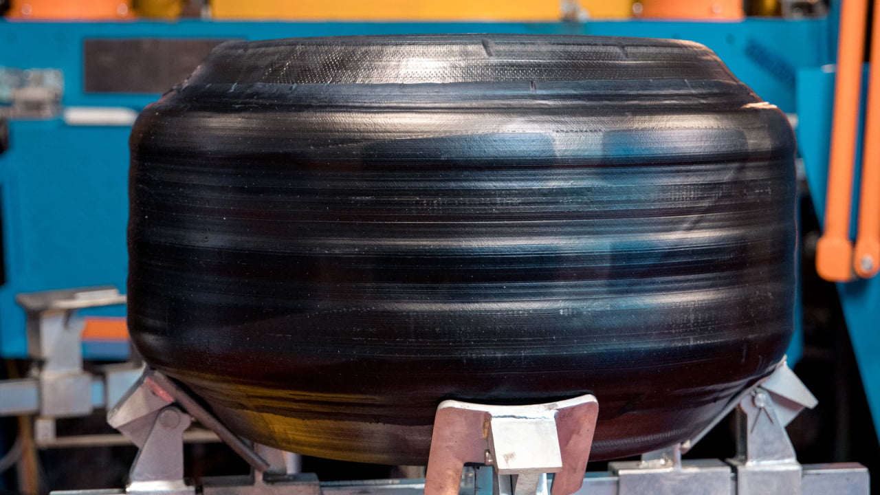 Once a tire has been shaped, it must be vulcanized. Vulcanization is a process that uses extreme heat to cure the rubber. (Photo credit: Bridgestone)